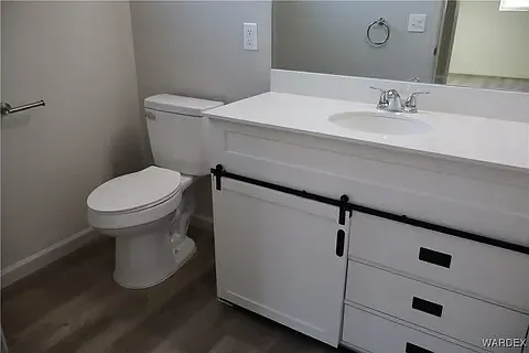 Elegant bathroom vanity with contemporary lighting at the Arditto residence